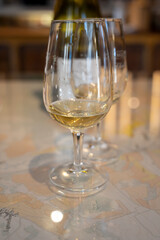 Tasting of white dry chablis wine in small winery in Chablis town, Burgundy, France