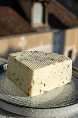 White sheep cheese with aromatic black cumin seeds served outdoor