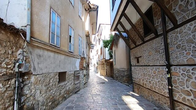 One if the old stone paved streets in the historical center of Ohrid, North Macedonia.