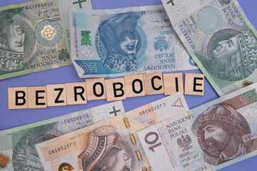 inscription bezrobocie which means unemployment next to polish money