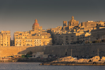 Fototapeta premium Valletta, Malta, 22 May 2022 : Beautiful view of Valletta skyline at sunset, view from Sliema