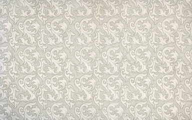 Used antique floral wallpaper with baroque shapes