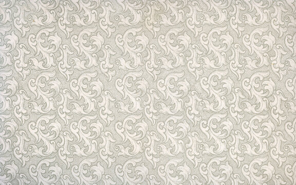 Used antique floral wallpaper with baroque shapes