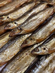 large vertical photo. smoked vendace. cold smoked golden fish. healthy seafood with omega 3. eco.
