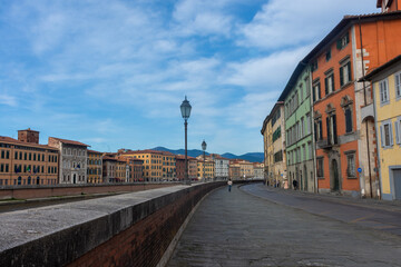Fototapeta premium Pisa, Italy, 14 April 2022: Banks of the Arno River