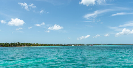 Fototapeta na wymiar boat sailing on blue waters of the caribbean
