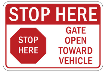 top at gate sign and labels stop here gate open toward vehicle