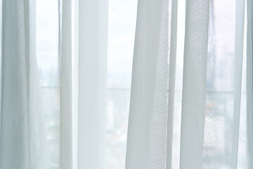 Semi-transparent tulle on the window close up