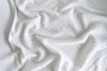 Fototapeta premium The texture of the wrinkled white fabric