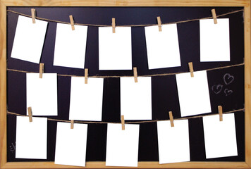 White Paper sheets hanging on the rope on wooden clothespins. Set of Blank notes on blackboard in a...