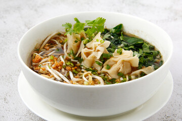 Freshly cooked Thai food called Chicken Wanton Noodle soup