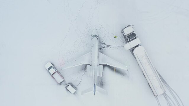 Top down of private business jet refueling by fuel truck in Iceland