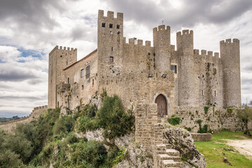 Fototapeta na wymiar Castle of Obidos, a medieval fortified village at cloudy day in Portugal