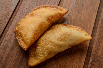 Pastries on wooden background. Traditional Brazilian snack known as 