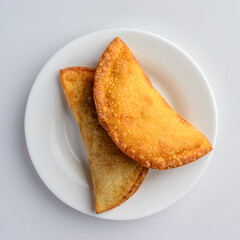 Pastries on white plate. Brazilian traditional pastry known as 