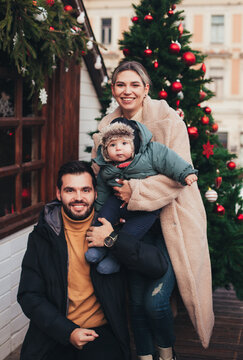 family on the street in christmas town