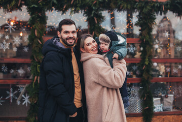 Fototapeta na wymiar family walk with baby before christmas