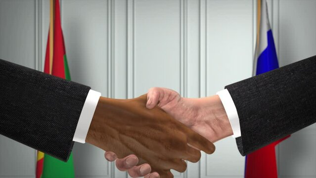 Burkina Faso and Russia deal handshake, politics  and illustration. Official meeting or cooperation, business meet. Businessmen or politicians shake hands