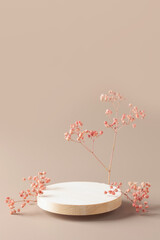 Empty round wooden podium for product presentation or cosmetics,  gypsophila flowers on  background.  Mock up concept.