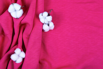 Pink cotton fabric with pleats and cotton flowers.