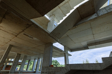 Concrete stairs in a multi-story building. bottom view