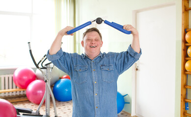 A man with Down syndrome does sports 