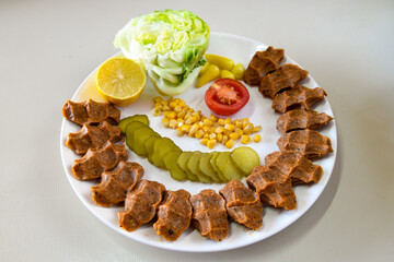Steak a la turca or chee kofta on a plate( Cig Kofte )  - Turkish Food.