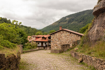 Stone houses and narrow streets in a mountain village in the north of Spain. barcena mayor