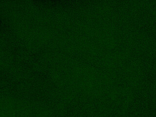 Dark green old velvet fabric texture used as background. Empty green fabric background of soft and...
