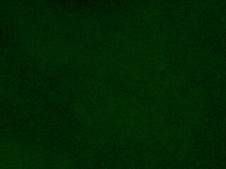 Dark green old velvet fabric texture used as background. Empty green fabric background of soft and smooth textile material. There is space for text...