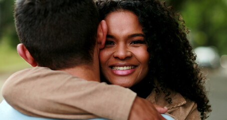 Beautiful African woman embracing boyfriend, loving caring relationship