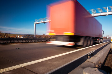 Trucks passing through the toll gate on highway, highway fee, industrial and transport concept