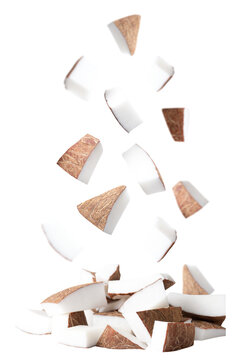 Flying chopped pieces of coconuts isolated on transparent background.