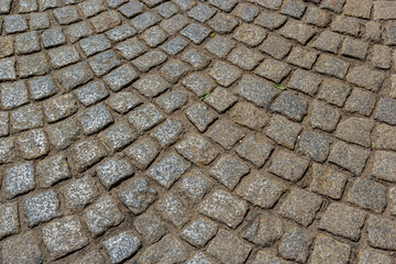 Cobblestone road. Gray cobblestone texture, vintage road surface