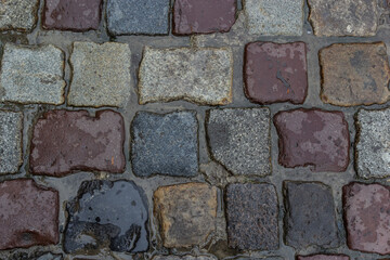 Cobblestone road. Gray cobblestone texture, vintage road surface