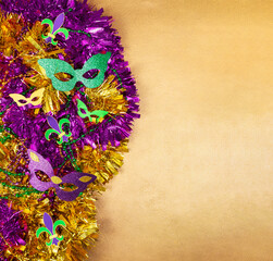 Multi color Mardi Gras background with beads and envelop. Top view