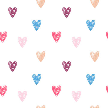 Vector seamless pattern with colored hearts on white background.  Hand drawn doodle style. Perfect for nursery fabrics, wrapping paper and wallpapers.