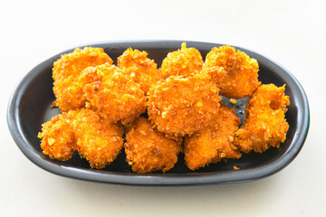 Fried Chicken breast hot crispy strips crunchy chicken tenders  isolated on white background.Nuggets isolated on white background on a plate