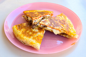 Turkish karisik atom Ayvalik tost ( kasarli bazlama tost) . Sucuklu, Kasarli, kavurmali karisik tost. Flat baked bread toasted