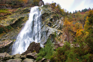 waterfall in autumn forest