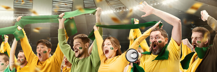 Group of emotive young people, football, soccer fans cheering Brazil team at the stadium....