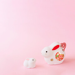 Japanese New Year's card material. zodiac rabbit. Rabbit on pink background. 日本の正月素材。干支のウサギ。ピンク背景上のウサギ。