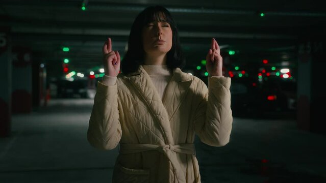 Lady female girl woman with closed eyes wish cross fingers pray for good luck wait success wishing praying win victory help beg dreaming need God support worried about result winning please gesture