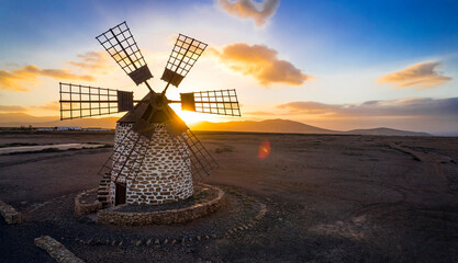 Spanish windmill over sunset. Scenery of Fuerteventura Canary island. aerial drone view of Tefia...