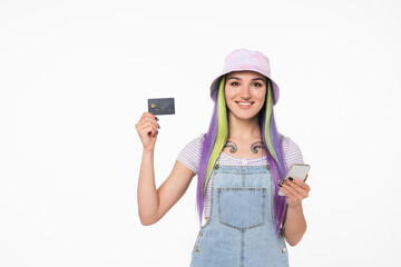 Young caucasian hipster teenage woman girl with tattoo holding credit card for internet banking,...