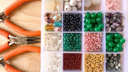 colourful beads with pliers.