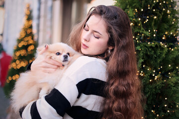 young girl with spitz dog