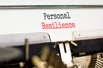 Personal resilience symbol. Concept word Personal resilience typed on retro old typewriter. Beautiful white background. Business psychological and personal resilience concept. Copy space.