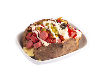 Kumpir, Turkish baked potato with cheese, corn, sausage, ketchup, mayonnaise and olives. This kumpir is traditional turkish food