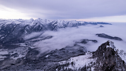 Fototapeta na wymiar clouds over the winter mountain valley